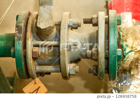 Basement.Plumbing sewage. Water valve, old rusty faucet Basement.Plumbing sewage. Water valve, old rusty faucet 126938758