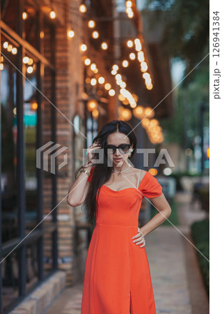 Young woman in outdoor cafe at summer day Young woman in outdoor cafe at summer day 126941384