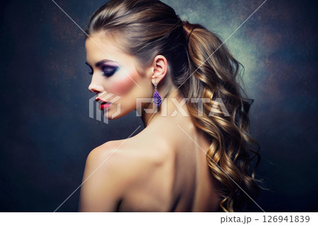 Earrings purple stone on fashion model young woman,open back 126941839