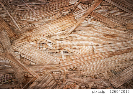 Background image of the rough surface of a wooden board glued together from a piece of wood 126942013
