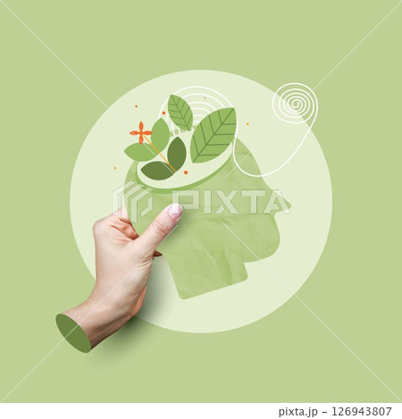 Mental health concept. hand holding a head with growing leaves, representing mental growth, cultivating the mind, healthy mind. cognitive function and mental clarity on green background. 126943807