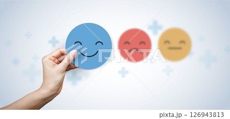 Medical concepts. doctor holding paper cut circle symbol face smile, happy, relax, satisfaction survey, positive, good, wellness, health child, hospital, world mental health day concept. 126943813