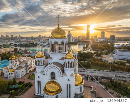 Autumn Yekaterinburg and Temple on Blood in beautiful clear sunset. Aerial view of Yekaterinburg, Russia. Translation of the text on the temple: Honest to the Lord is the death of His saints. Autumn Yekaterinburg and Temple on Blood in beautiful clear sunset. Aerial view of Yekaterinburg, Russia. Translation of the text on the temple: Honest to the Lord is the death of His saints. 126944827