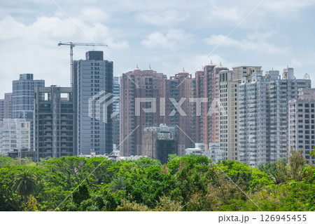 Modern downtown condominium building with plant tree park nature for fresh air green city Modern downtown condominium building with plant tree park nature for fresh air green city 126945455