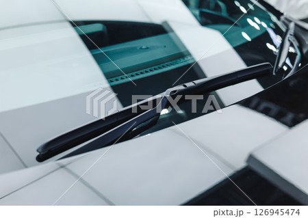 Modern car font glass windshield wiper clean new closeup shot Modern car font glass windshield wiper clean new closeup shot 126945474