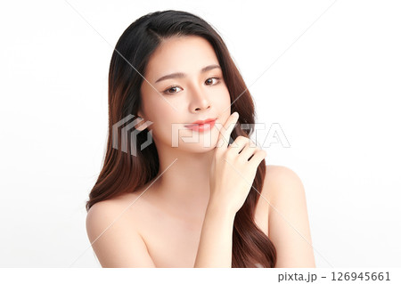 A beautiful young Asian woman with clean, fresh skin against a white background. Skincare, facial treatment, cosmetology, beauty, and spa. An elegant portrait of an Asian woman. A beautiful young Asian woman with clean, fresh skin against a white background. Skincare, facial treatment, cosmetology, beauty, and spa. An elegant portrait of an Asian woman. 126945661