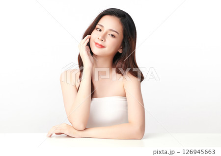A beautiful young Asian woman with clean, fresh skin against a white background. Skincare, facial treatment, cosmetology, beauty, and spa. An elegant portrait of an Asian woman. A beautiful young Asian woman with clean, fresh skin against a white background. Skincare, facial treatment, cosmetology, beauty, and spa. An elegant portrait of an Asian woman. 126945663