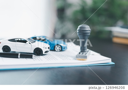 Approved car loan application with car key, rubber stamp and calculator concept. financial document on wooden table. Asset approval purchases to buy car. Ideas for car buying checklist loan tax Approved car loan application with car key, rubber stamp and calculator concept. financial document on wooden table. Asset approval purchases to buy car. Ideas for car buying checklist loan tax 126946208