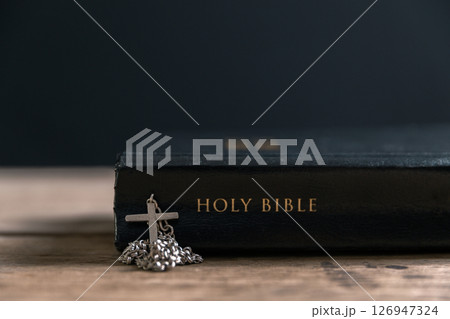 Religious belief concept Close up prayer Christian church service Bible Holy cross Spiritual power Blurred background Desk copy space Heaven God Catholic faith Praise book Jesus worship Gospel symbols Religious belief concept Close up prayer Christian church service Bible Holy cross Spiritual power Blurred background Desk copy space Heaven God Catholic faith Praise book Jesus worship Gospel symbols 126947324