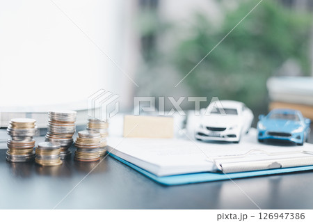 Approved car loan application with car key, rubber stamp and calculator concept. financial document on wooden table. Asset approval purchases to buy car. Ideas for car buying checklist loan tax Approved car loan application with car key, rubber stamp and calculator concept. financial document on wooden table. Asset approval purchases to buy car. Ideas for car buying checklist loan tax 126947386