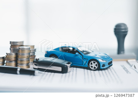 Approved car loan application with car key, rubber stamp and calculator concept. financial document on wooden table. Asset approval purchases to buy car. Ideas for car buying checklist loan tax Approved car loan application with car key, rubber stamp and calculator concept. financial document on wooden table. Asset approval purchases to buy car. Ideas for car buying checklist loan tax 126947387