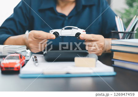 Businesswoman hand stamp approve on financial business approval document paper. Man hand accept permit contract agreement. Broker manager sign contract bank guarantee approved stamp application form 126947459