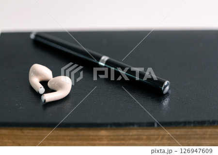 Close-up religious technology headphones pray bible church laptop Jesus Christ Holy Spirit Sunday service spiritual power blur background phone concept heaven belief gospel faith praise worship god 126947609