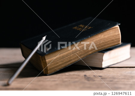 Religious belief concept Close up prayer Christian church service Bible Holy cross Spiritual power Blurred background Desk copy space Heaven God Catholic faith Praise book Jesus worship Gospel symbols Religious belief concept Close up prayer Christian church service Bible Holy cross Spiritual power Blurred background Desk copy space Heaven God Catholic faith Praise book Jesus worship Gospel symbols 126947611