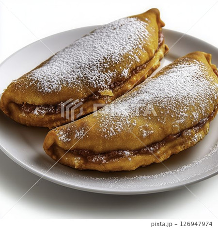 Delicious Sweet Crepes with Powdered Sugar and Berry Filling on White Plate 126947974