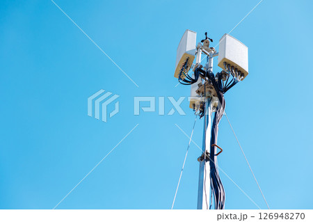 omni setup outdoor wifi, wireless internet network access point tower, 5G antenna against clear blue sky omni setup outdoor wifi, wireless internet network access point tower, 5G antenna against clear blue sky 126948270