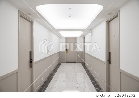 Hotel apartment hallway room door floor with modern lighting at ceiling with fire safety sprinkler Hotel apartment hallway room door floor with modern lighting at ceiling with fire safety sprinkler 126948272