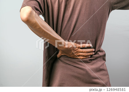 Portrait of man feeling back pain isolated over white background. Concept of healthcare 126948581