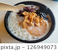 Traditional Taiwanese Dessert with spoon, Tapioca Pearls, Red Beans, and Sweet Toppings 126949073