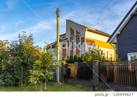 Brest Belarus colorful village streets with wooden huts brick houses . Brest Belarus colorful village streets with wooden huts brick houses . 126949827
