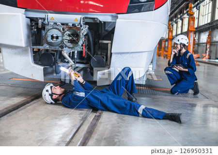 Train engineer working check inspecting railway track at Train station, advance engineering Train engineer working check inspecting railway track at Train station, advance engineering 126950331