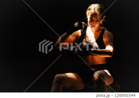 Muay thai, strong women fighter wrapped fist to Bare Knuckle fighting Asian kick boxing style people 126950344