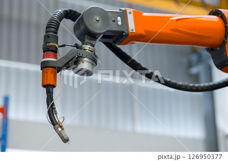 closeup welder head Robotic Smart Welding Machine. Welder arm machine, Robotic Welding or Robotic Arm Welding at Industrial Factory. 126950377