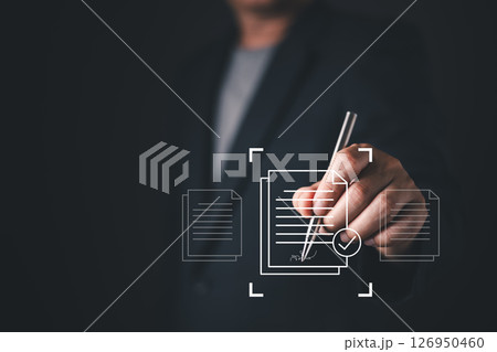 person in formal attire interacts with a digital interface displaying icons of signed documents and electronic approval symbols, representing digital document management and electronic authorization. 126950460