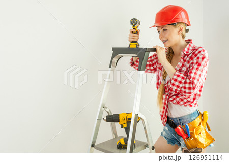 Woman with repairing tools and ladder 126951114