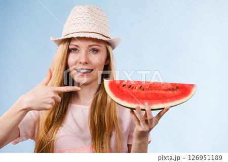 Happy woman holding watermelon Happy woman holding watermelon 126951189