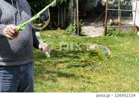 Soap bubble, outdoors activity and leisure for happy kid, real life photo 126952134
