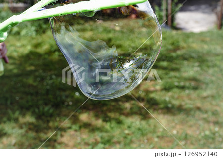 Soap bubble, outdoors activity and leisure for happy kid, real life photo 126952140