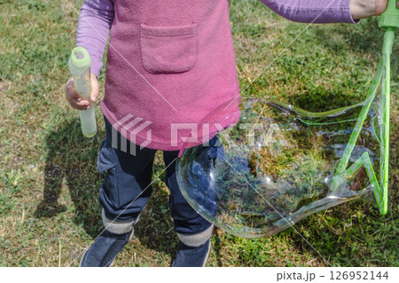 Soap bubble, outdoors activity and leisure for happy kid, real life photo Soap bubble, outdoors activity and leisure for happy kid, real life photo 126952144