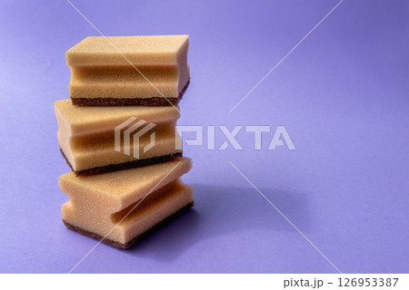 three dish sponges on the violet background 126953387