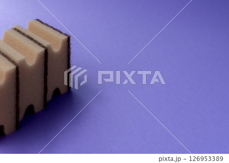 three dish sponges on the violet background 126953389