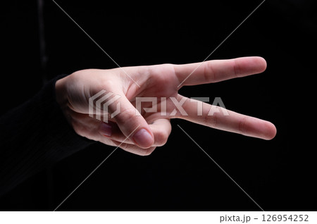 Woman's hand showing two fingers up, . Peace, fight, victory symbol, letter V in sign language or number two or second 126954252