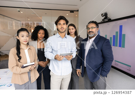 Diverse professional business team standing together in a modern office 126954387
