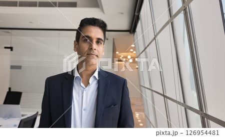 Head shot portrait of confident Indian businessman in formal suit Head shot portrait of confident Indian businessman in formal suit 126954481