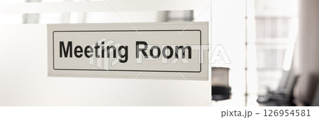 Closeup signboard of Meeting Room displayed on glass wall Closeup signboard of Meeting Room displayed on glass wall 126954581
