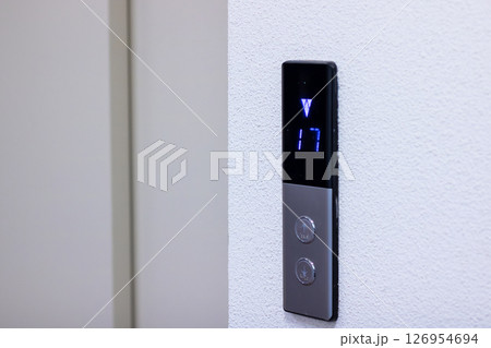 An elevator control panel featuring the number 17 prominently displayed on it An elevator control panel featuring the number 17 prominently displayed on it 126954694