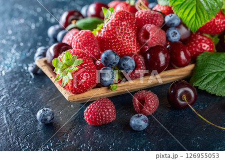 Berries closeup colorful assorted mix. 126955053