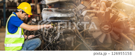 staff worker working in scrapyard with old car spare part warehouse garage center wide for banner background staff worker working in scrapyard with old car spare part warehouse garage center wide for banner background 126955158