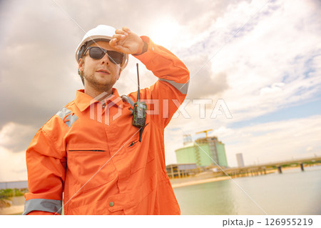 male worker in safety uniform sweating working outdoor in hot summer season, over work, hard work people 126955219