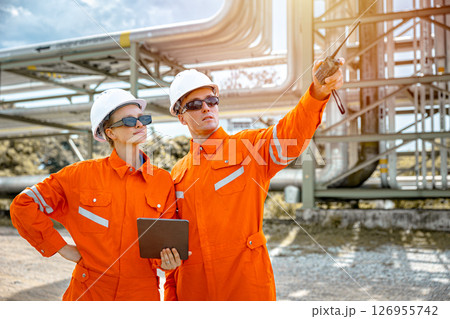 Petroleum refinery service worker, Oil and Gas outdoor pipes and valve inspector, Gas leak checking Petroleum refinery service worker, Oil and Gas outdoor pipes and valve inspector, Gas leak checking 126955742