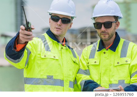 Professional Caucasian Engineer male workers team, Serious working outdoor with safety reflective 126955760