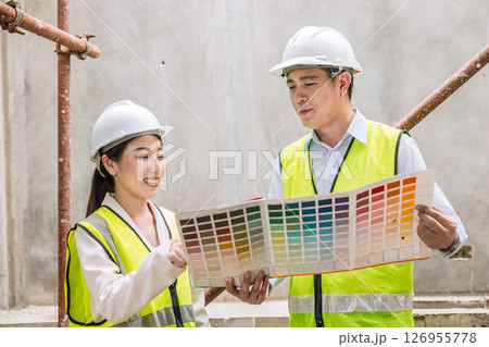 Interior designer team meeting with decorator selection painting, Colors selection process, home project color choice from colors chart 126955778