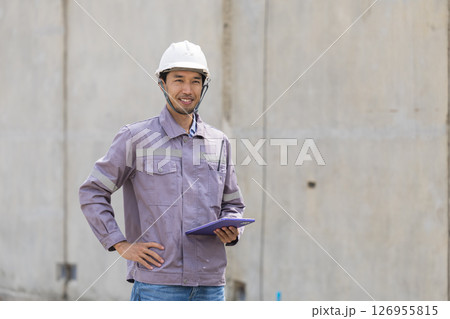 Portrait Professional Asian construction engineer, Japanese builder worker male working site 126955815