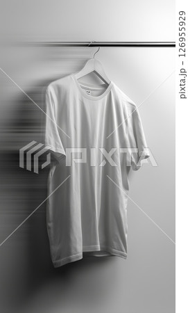 Clean white shirt laid flat on a wooden table, perfect for adding graphics or text 126955929