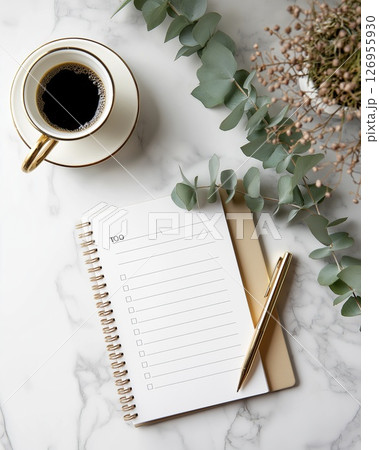 Coffee cups and blank to-do notebook on marble 126955930