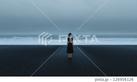 Solitary woman stands at the ocean 126956126